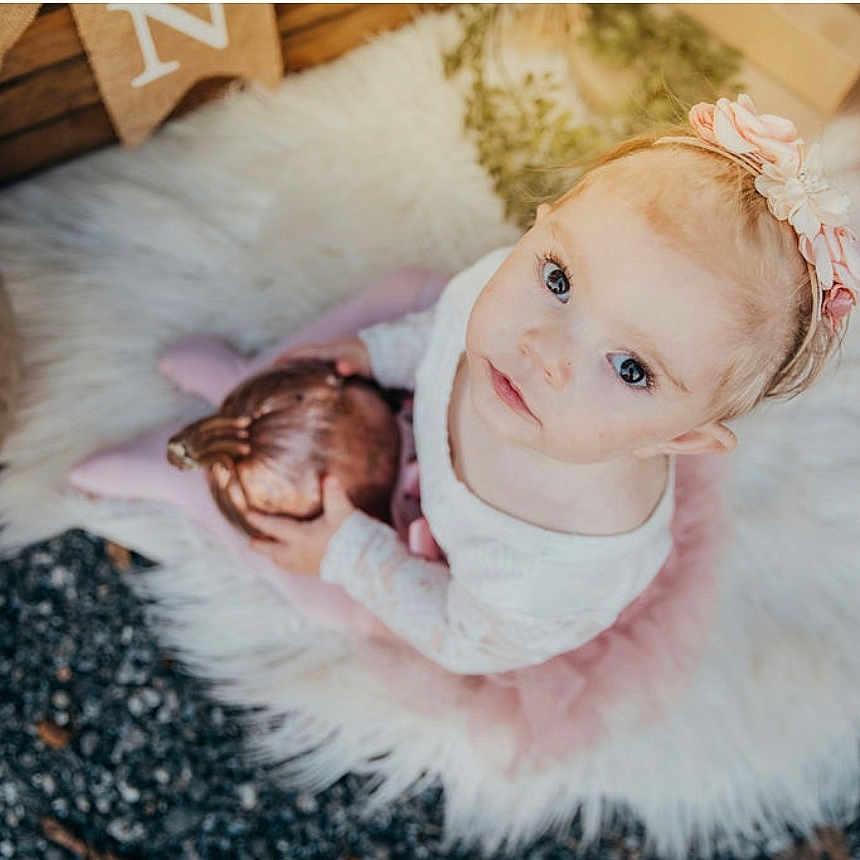 Bexleigh joined the competition — help win amazing prizes! autumn, baby, child, curious, cute, decor, fall, flower, fluffy_rug, girl, headband, looking_up, outdoor, pink_tutu, portrait, pumpkin, seasonal, sitting, soft_lighting, toddler