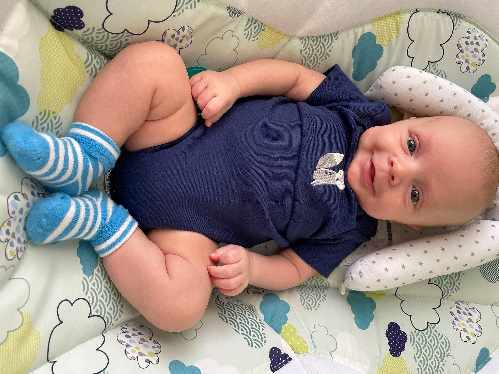 Caden is registered to the contest to win money with this photo: azure, baby, baby_toddler_clothing, child, comfort, finger, happy, headgear, human_body, human_leg, knee, linens, nail, pattern, person, product, skin, sleeve, textile, thigh