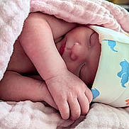 Khloe is registered to the contest to win money with this photo: baby, blanket, child, closeup, comfort, cozy, cute, face, hand, hat, infant, newborn, patterned_hat, peaceful, pink, rest, skin, sleeping, soft, wrapped