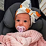Khloe is registered to the contest to win money with this photo: baby, black, blanket, car_seat, child, comfort, cozy, cute, face, headband, infant, orange, pacifier, pink, pumpkin, soft_texture, spider_web, white, wide_eyes, young