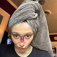 Comet joined the competition — help win amazing prizes! person, kitten, cat, towel, face, indoor, selfie, filter, funny, curious, hair_wrap, clothing, shirt, expression, room, ceiling, wall, light, pet, cute