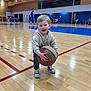Charly a rejoint le concours — aidez-le/la à gagner de superbes lots ! toddler, basketball, gymnasium, child, sports, court, wood_floor, casual_clothing, sneakers, happy, indoor, game, people, team, athlete, blue_uniform, action, smile, young_child, recreation