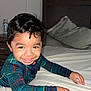 Arturo joined the competition — help win amazing prizes! child, toddler, smiling, indoor, bed, pillow, blanket, pajamas, plaid, dark_hair, portrait, happy, cute, eyes, bedroom, nightstand, water_bottle, hand, skin, flash_photography