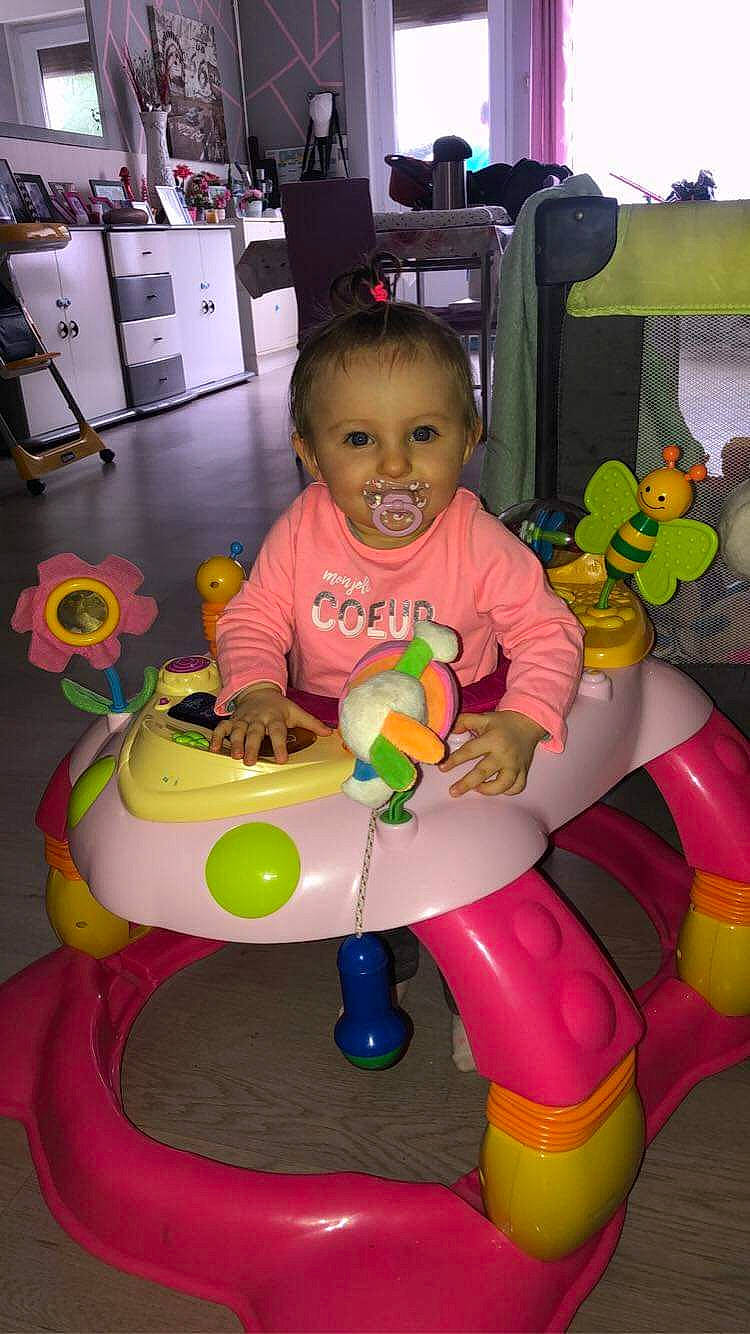 Madysson participe au concours pour gagner de l'argent avec cette photo : baby, baby_playing_with_toys, baby_products, baby_toddler_clothing, baby_toys, child, facial_expression, fun, happy, leisure, magenta, person, pink, play, product, riding_toy, sitting, smile, toddler, toy