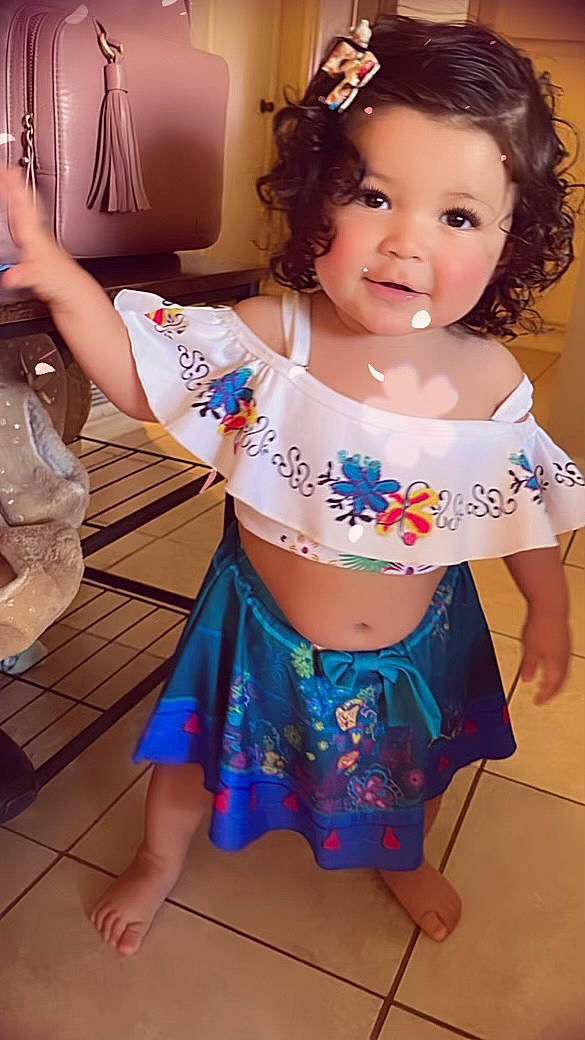 Amirah is registered to the contest to win money with this photo: baby_toddler_clothing, black_hair, chest, eye, face, facial_expression, hairstyle, happy, human_body, iris, joint, neck, organ, person, pink, skin, smile, thigh, toddler, trunk
