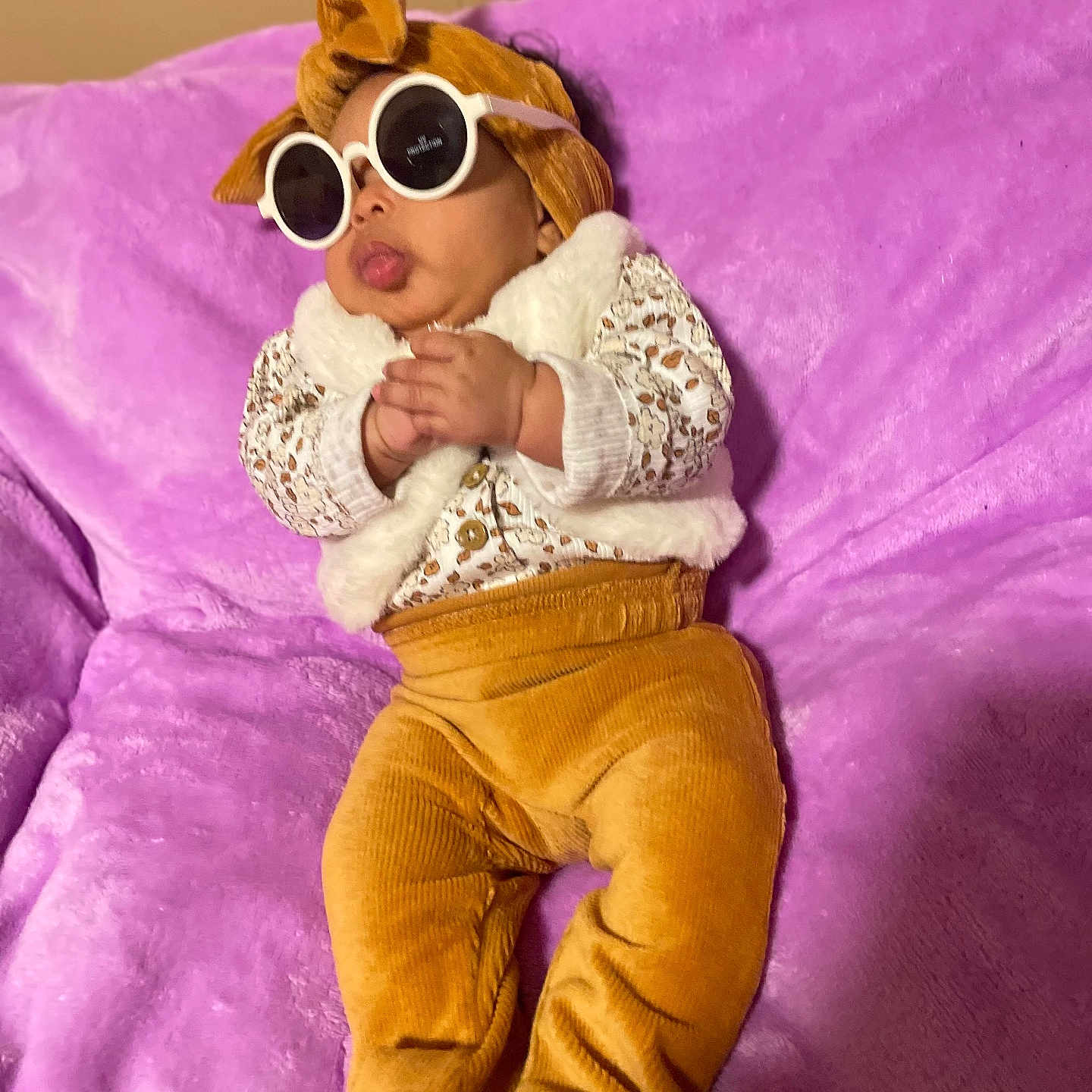 Myhitrice joined the competition — help win amazing prizes! accessory, baby, bare_feet, casual, child, clothing, cozy, cute, fashion, headwrap, indoor, infant, mustard_pants, patterned_top, plush, portrait, purple_blanket, relaxed, sunglasses, vest
