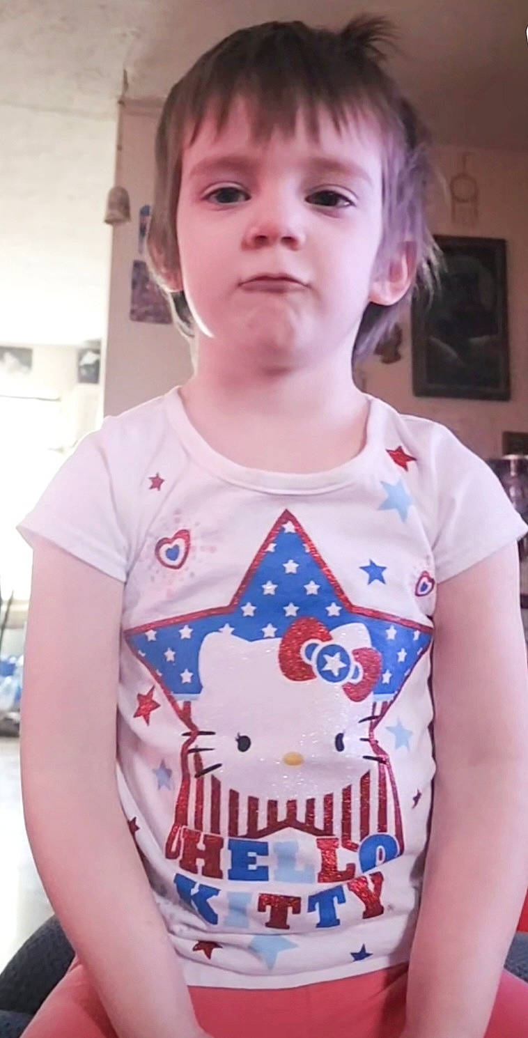 August is registered to the contest to win money with this photo: baby_toddler_clothing, beauty, cheek, child, electric_blue, eyelash, face, facial_expression, fun, hairstyle, happy, neck, pattern, person, picture_frame, play, shoulder, sleeve, t_shirt, toddler