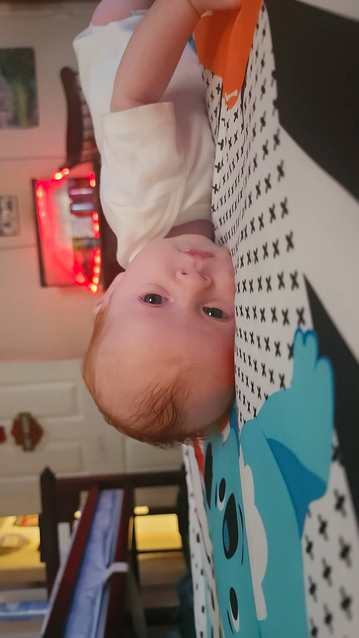 Audrey is registered to the contest to win money with this photo: baby, baby_products, baby_toddler_clothing, cheek, chest, child, comfort, elbow, eyelash, fun, happy, human_body, lighting_accessory, lip, nail, nose, pattern, person, room, toddler