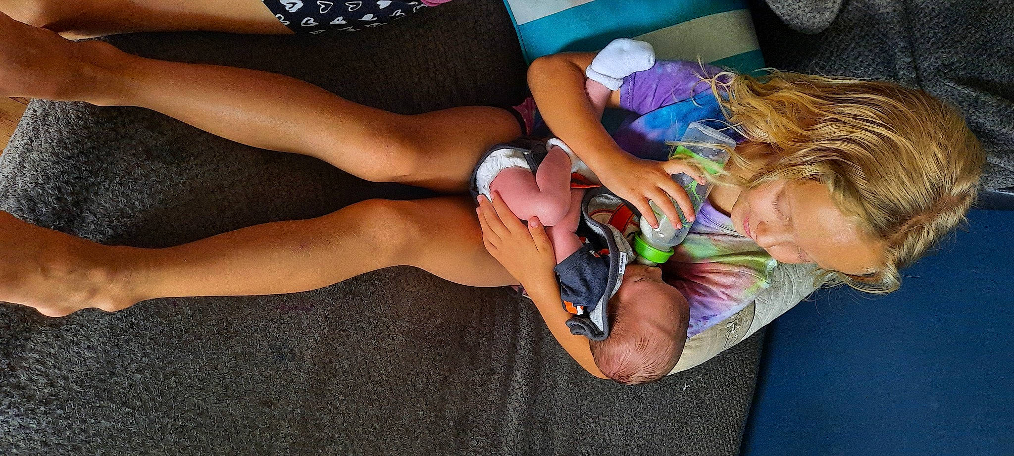 Haylee joined the competition — help win amazing prizes! arm, calf, comfort, finger, foot, happy, human_body, human_leg, joint, knee, lap, leg, mechanical_fan, nail, person, shorts, sock, thigh, toddler, trunk