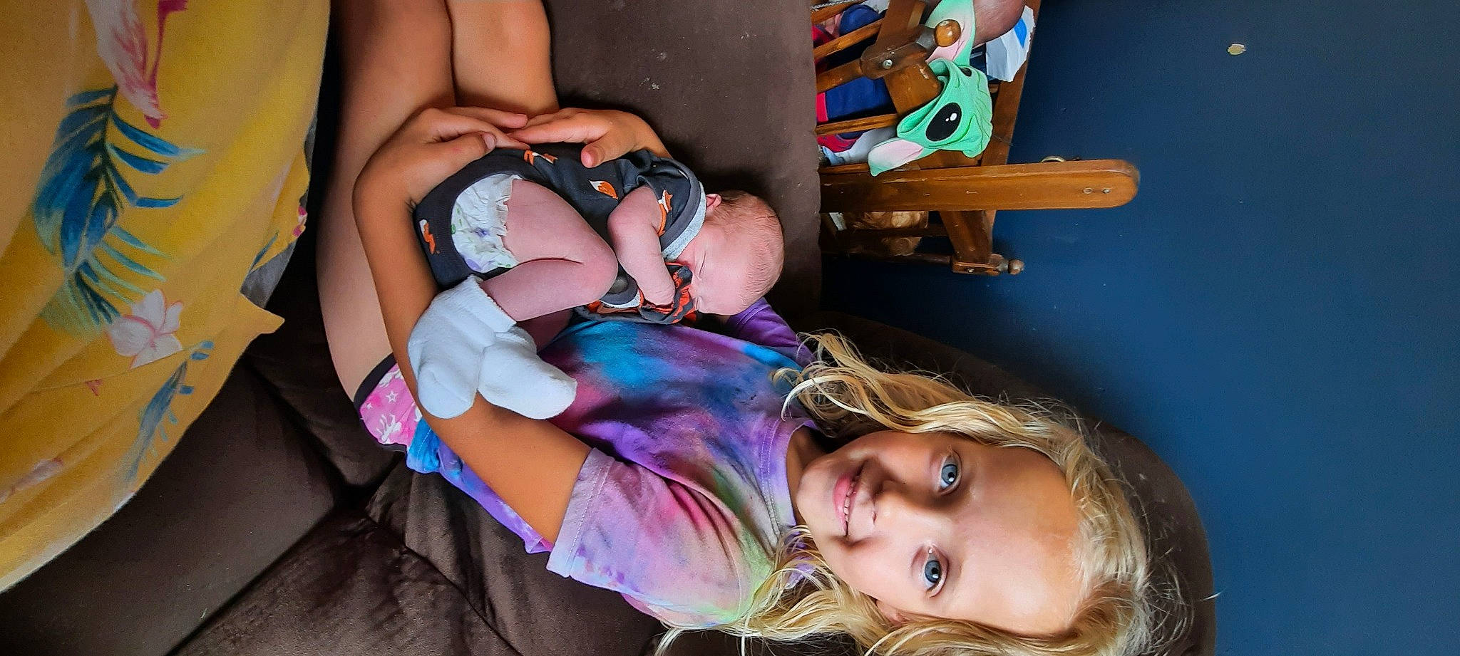 Haylee joined the competition — help win amazing prizes! baby, child, comfort, eyewear, fun, gesture, glasses, happy, human_body, human_leg, joy, mouth, nail, person, purple, sitting, skin, smile, thigh, toddler