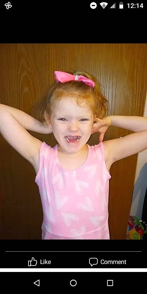 Hannah is registered to the contest to win money with this photo: arm, baby_toddler_clothing, cool, dress, eyebrow, eyelash, finger, flash_photography, gesture, happy, headgear, human_body, iris, joy, magenta, neck, person, pink, shoulder, sleeve