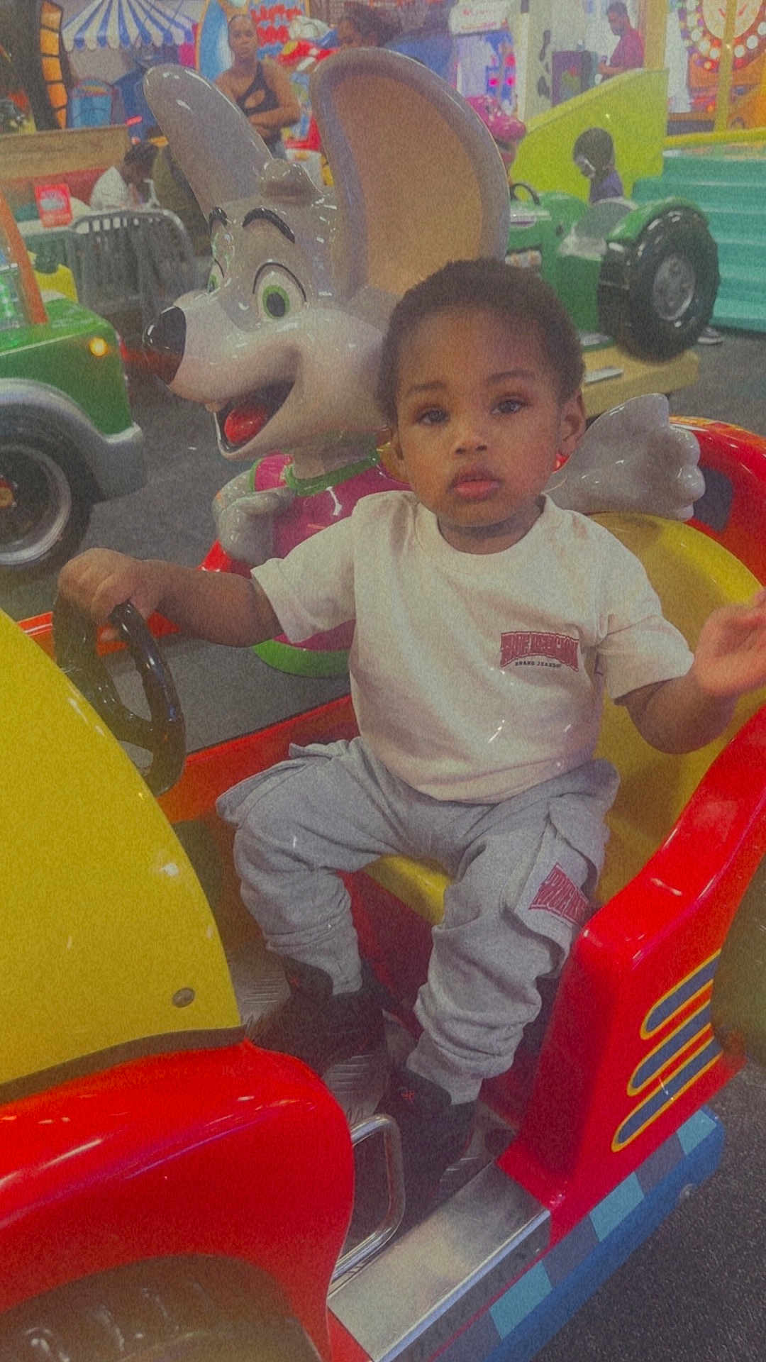 Zyere joined the competition — help win amazing prizes! toddler, child, kiddie_ride, car, arcade, amusement, cartoon_mouse, colorful, indoor, people, toy, steering_wheel, play, fun, casual_clothing, pants, tshirt, shoes, entertainment, family