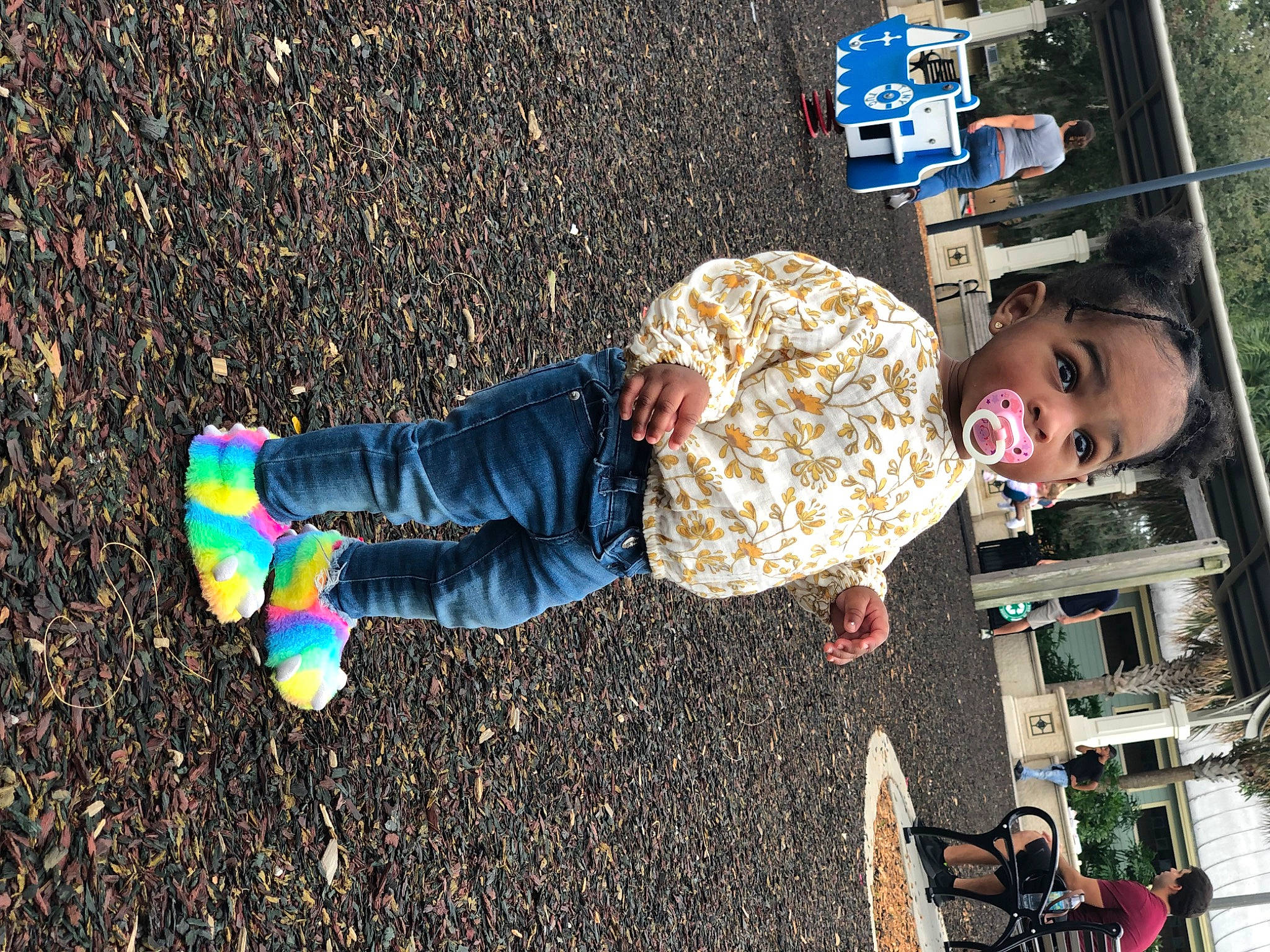 Chanel is registered to the contest to win money with this photo: asphalt, child, city, fun, grass, happy, leisure, people_in_nature, person, play, recreation, road_surface, shadow, sidewalk, sitting, smile, soil, street, street_fashion, toddler