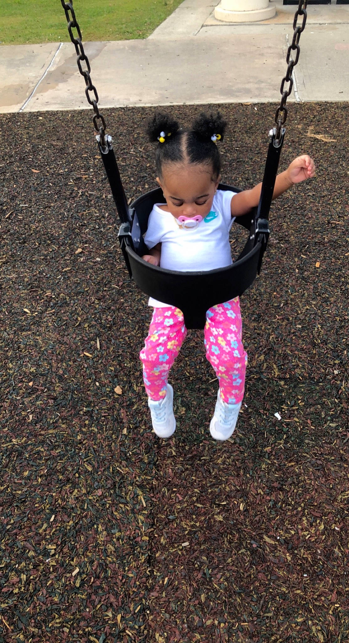 Chanel joined the competition — help win amazing prizes! arm, baby_toddler_clothing, child, city, face, fun, grass, happy, knee, leisure, outdoor_play_equipment, pattern, people_in_nature, person, play, playground, recreation, sitting, soil, swing