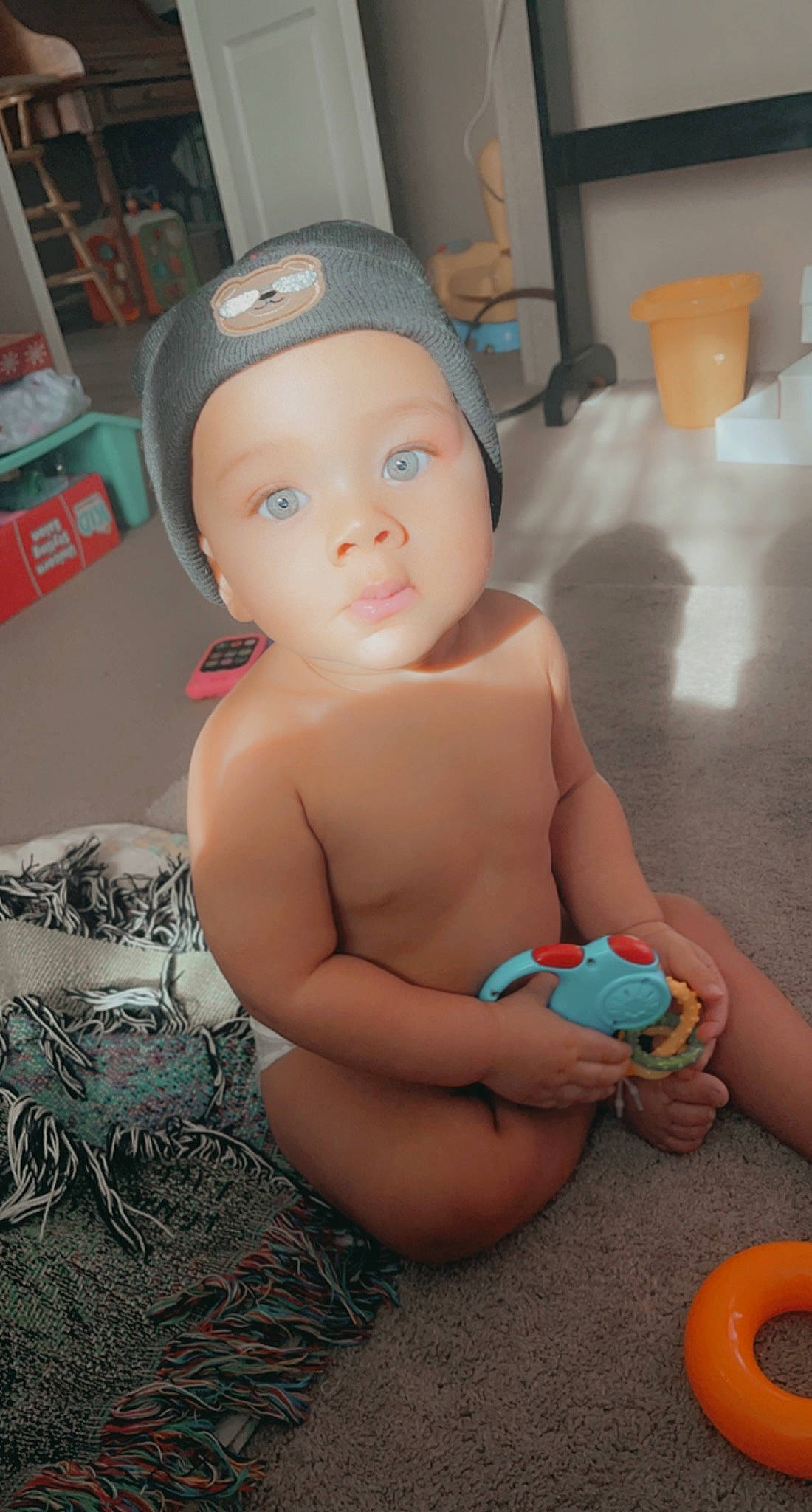 Bryiar is registered to the contest to win money with this photo: abdomen, baby, baby_playing_with_toys, bathing, cap, cheek, chest, child, finger, flooring, fun, hat, headwear, mouth, person, room, sitting, skin, thigh, thumb