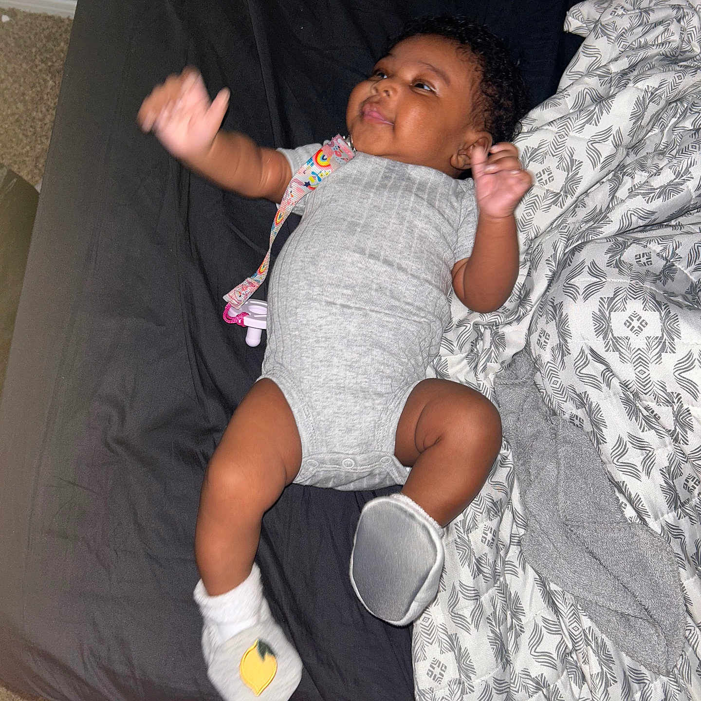 Kahlilah is registered to the contest to win money with this photo: baby, bed, bedroom, bodypart, clothing, couch, cushion, face, finger, furniture, hand, head, homedecor, hosiery, indoors, person, photography, portrait, shorts, sock