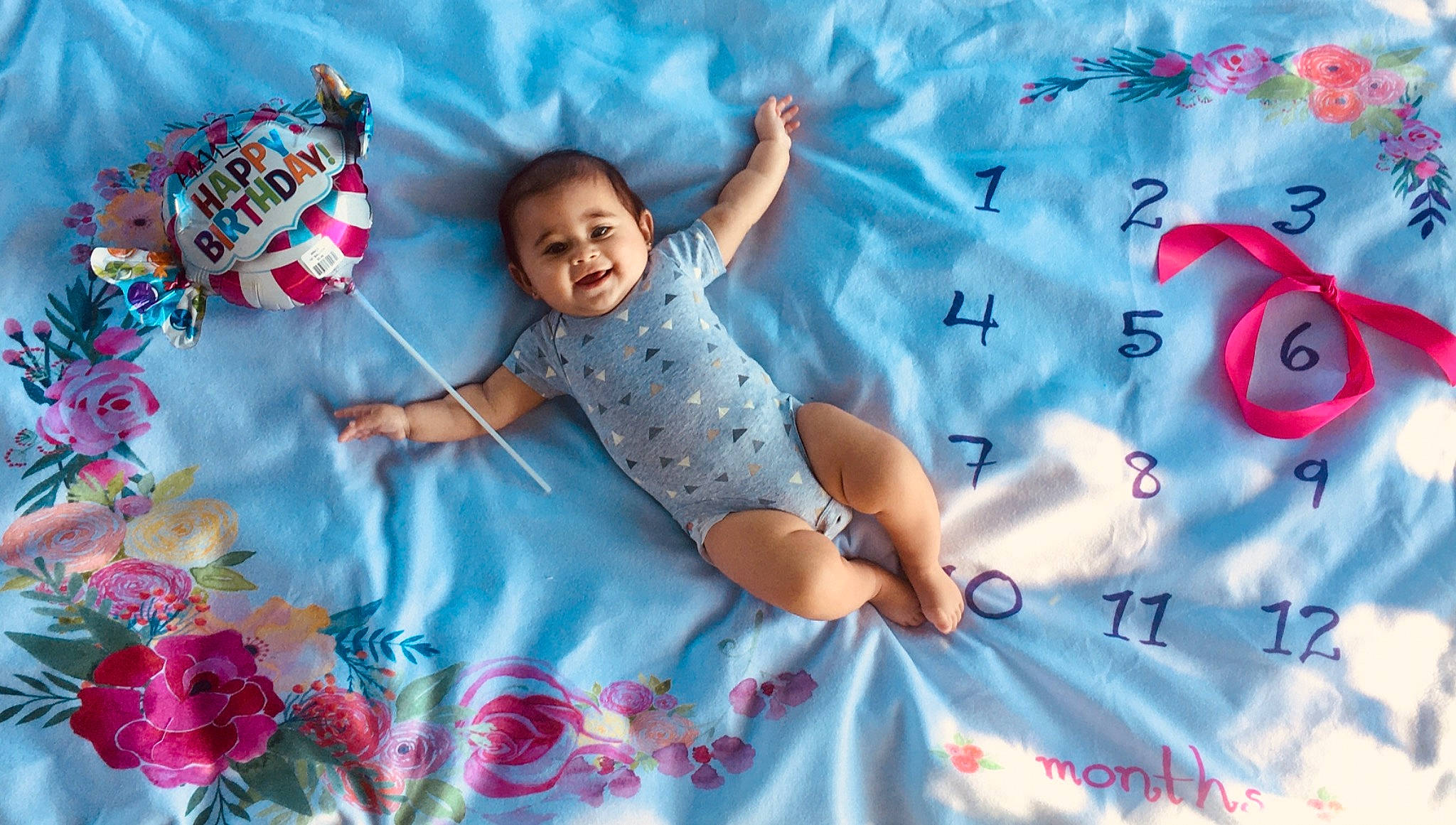 Ximena is registered to the contest to win money with this photo: art, azure, baby, baby_toddler_clothing, beauty, child, facial_expression, fun, happy, joy, linens, pattern, people, people_in_nature, person, pink, product, sleeve, smile, summer
