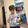 Aryan is registered to the contest to win money with this photo: baby, boy, carpet, casual, child, closet, clothing, crawling, curtain, door, floor, hair, indoor, person, playful, room, shirt, sibling, smile, toy