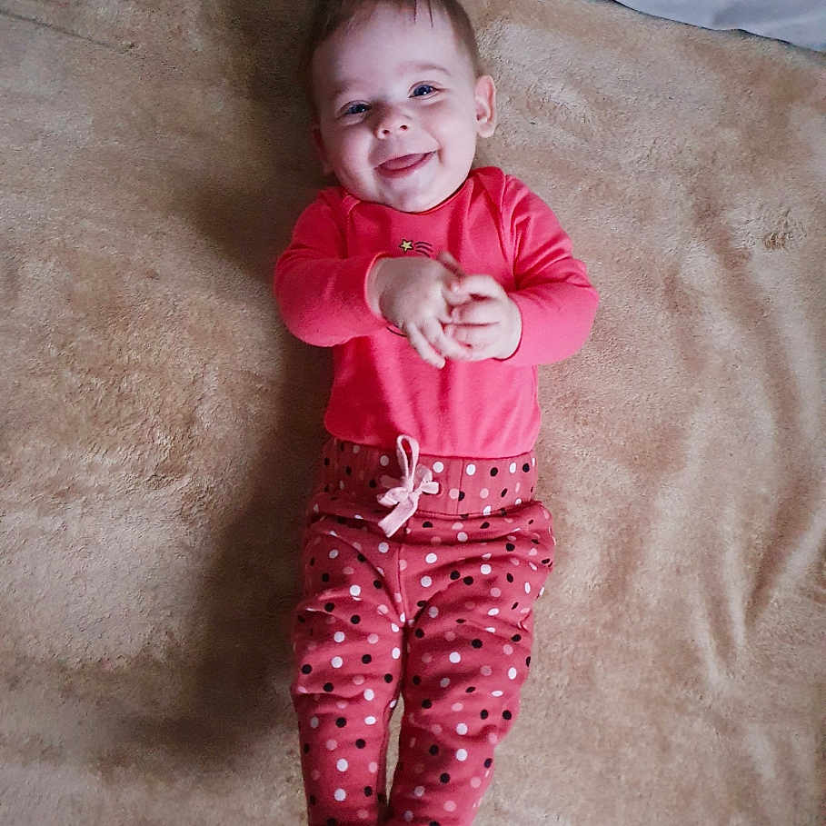 Antonina is registered to the contest to win money with this photo: baby, bed, bedroom, bodypart, clothing, couch, cushion, face, finger, fleece, furniture, hand, happy, head, homedecor, indoors, laughing, mouth, newborn, pajamas