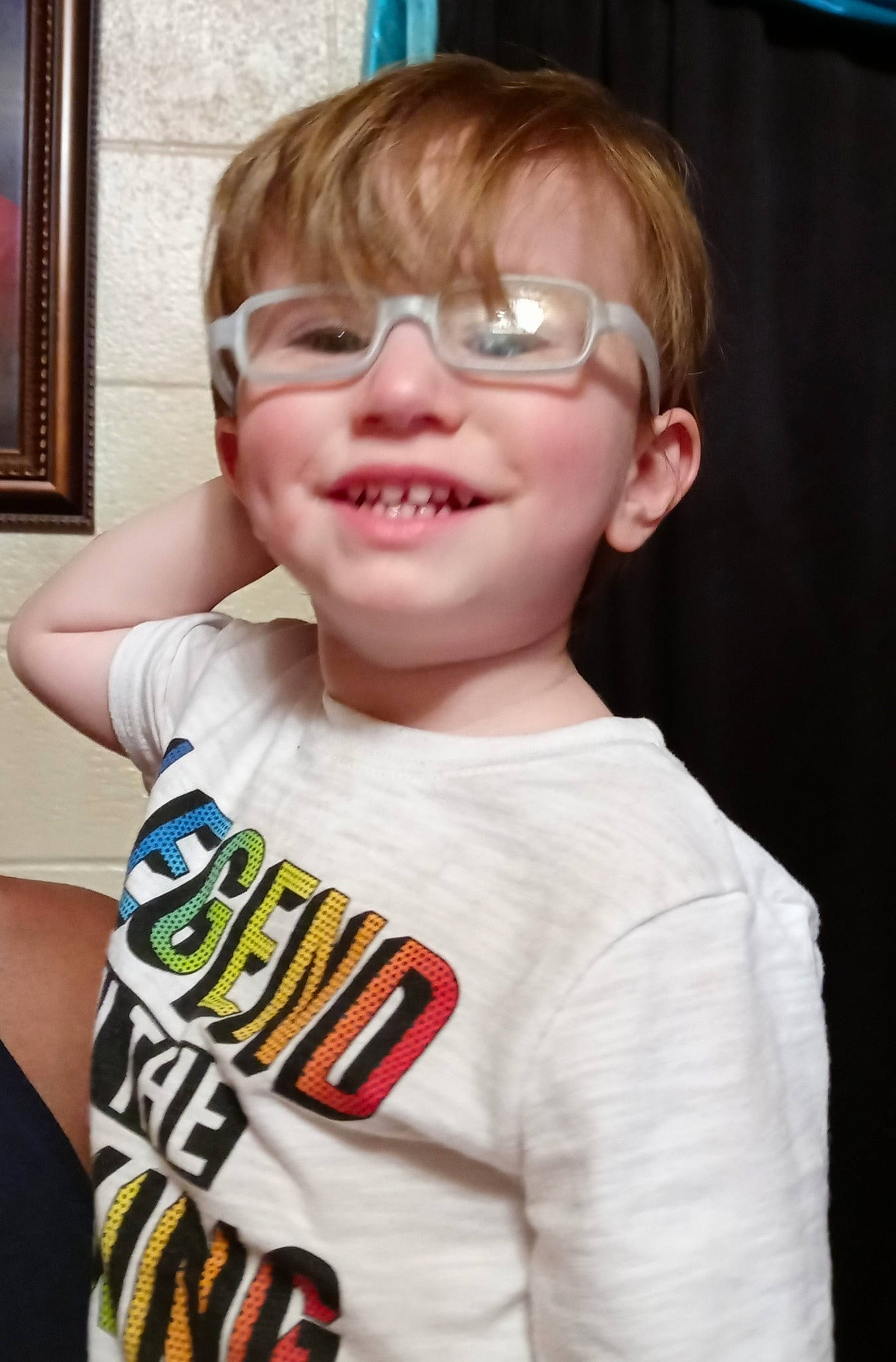 Zaydon is registered to the contest to win money with this photo: blue, cheek, chin, eyebrow, eyewear, face, facial_expression, forehead, gesture, glasses, happy, head, joy, neck, nose, person, picture_frame, shoulder, sleeve, smile