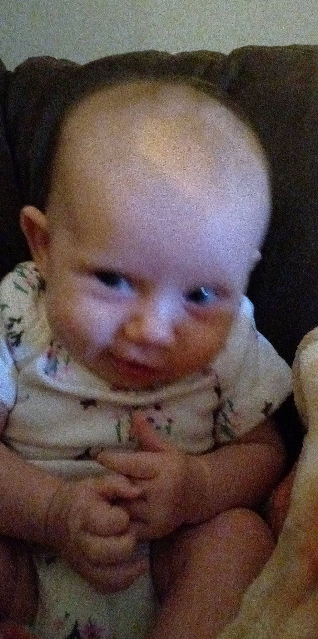 Laura is registered to the contest to win money with this photo: baby, baby_toddler_clothing, cheek, chin, dress, ear, eye, eyebrow, finger, forehead, gesture, hand, iris, lip, mouth, neck, nose, person, skin, thumb