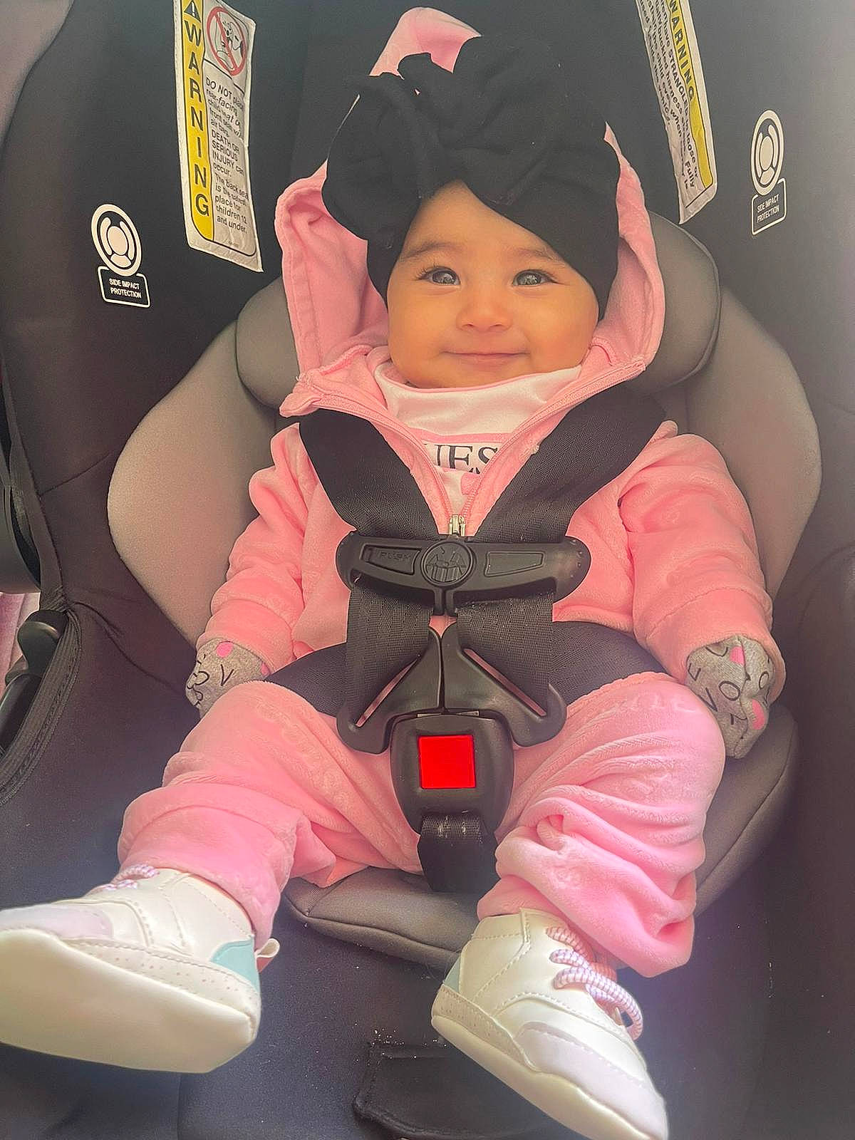 Sandra Sierra joined the competition — help win amazing prizes! baby_carriage, baby_toddler_clothing, boot, cap, car_seat, carmine, child, comfort, cool, fun, happy, headwear, joy, magenta, person, personal_protective_equipment, pink, recreation, sitting, sleeve