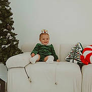 Alice is registered to the contest to win money with this photo: accessories, architecture, baby, building, couch, cushion, face, fir, furniture, head, homedecor, indoors, livingroom, person, photography, plant, portrait, pottedplant, room, tree