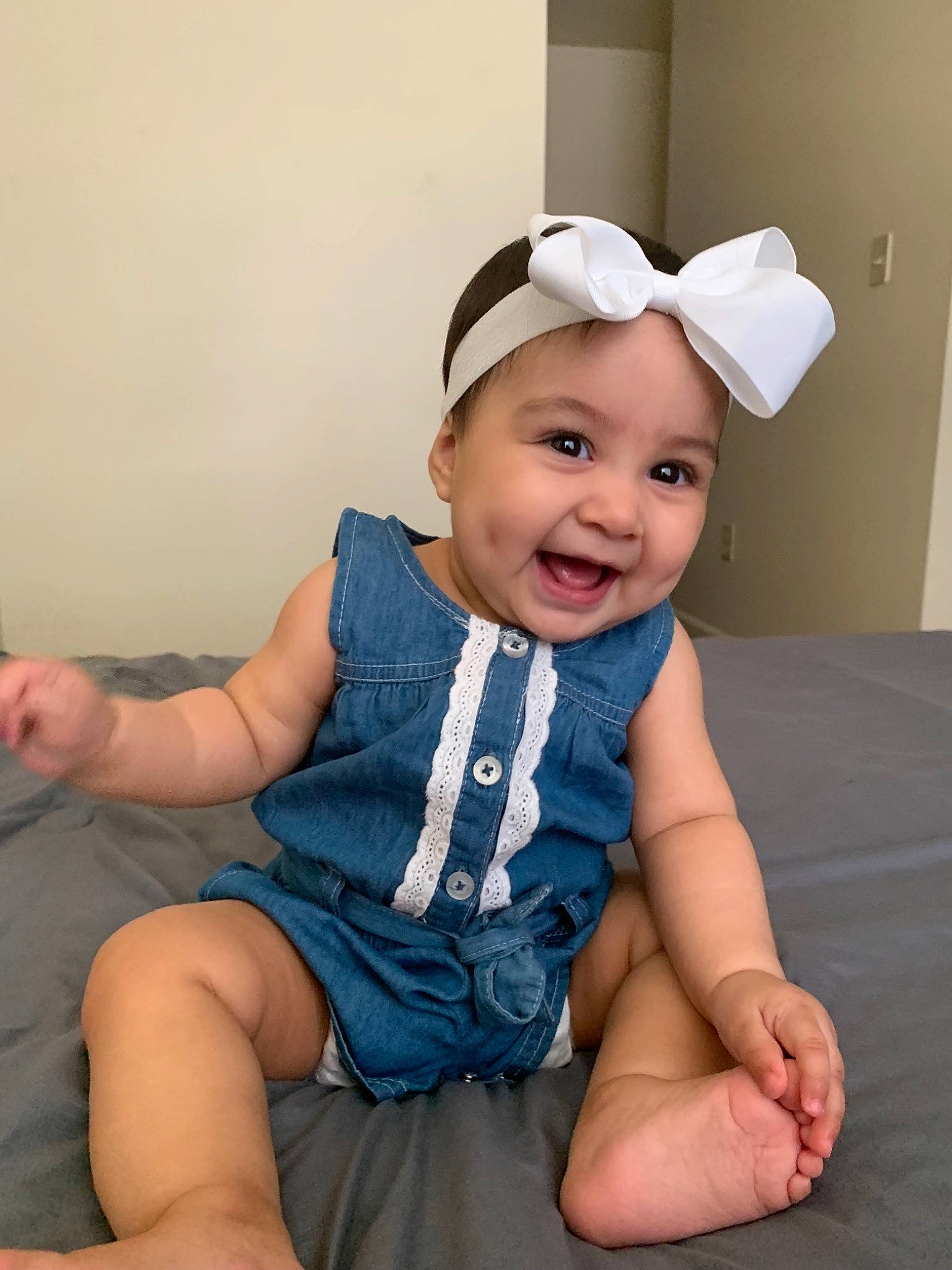 Athena joined the competition — help win amazing prizes! arm, baby, baby_toddler_clothing, blue, cap, child, ear, fashion_accessory, headgear, leg, person, pink, sitting, skin, sleeve, smile, toddler
