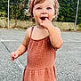 Cataleya participe au concours pour gagner de l'argent avec cette photo : toddler, child, smiling, standing, dress, headband, curly_hair, outdoor, fence, hedge, blue_eyes, sandals, happy, person, fashion, summer, daylight, pavement, cute, portrait