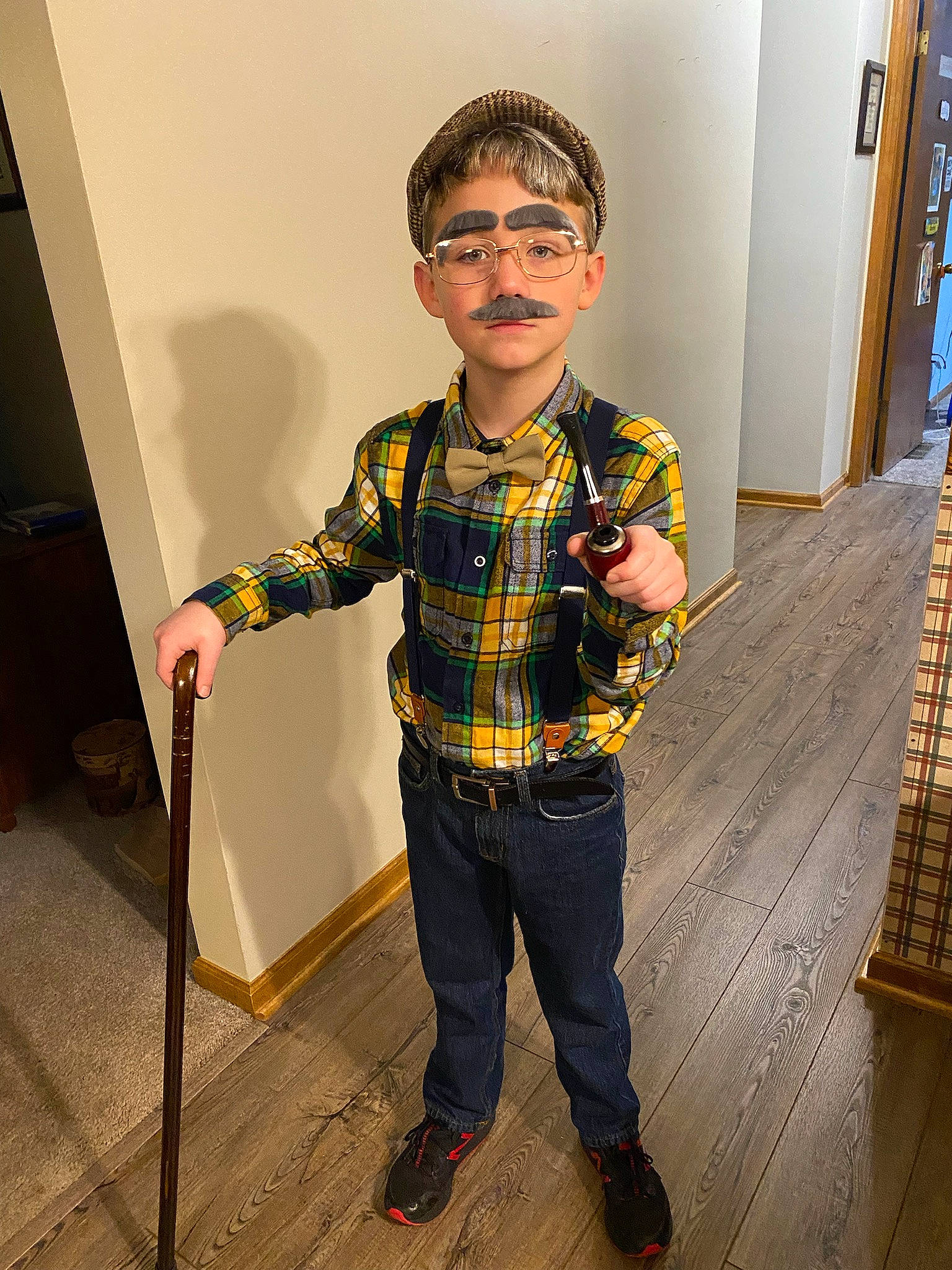 Bently Allen Jeffery is registered to the contest to win money with this photo: denim, dress_shirt, eyewear, fashion_design, floor, flooring, fun, glasses, happy, pattern, person, personal_protective_equipment, plaid, sitting, sleeve, t_shirt, tartan, toddler, vision_care, waist