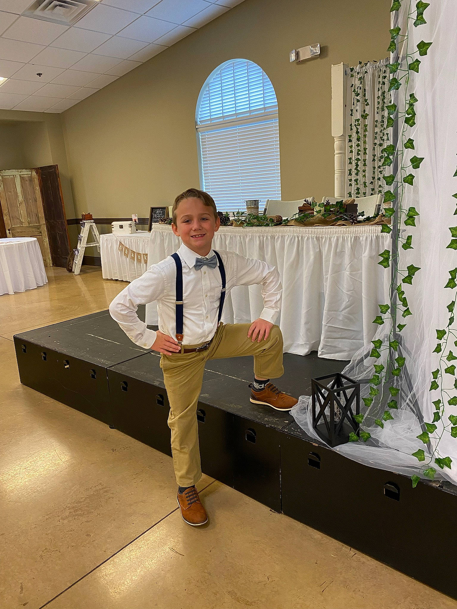 Bently Allen Jeffery is registered to the contest to win money with this photo: child, collar, curtain, dress_shirt, event, floor, flooring, floral_design, formal_wear, houseplant, joy, person, plant, room, sleeve, smile, tie, toddler, uniform, white_collar_worker