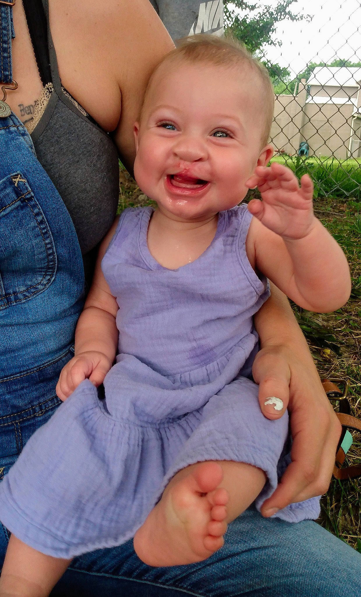 Denaleigh Lane Foor is registered to the contest to win money with this photo: arm, baby_toddler_clothing, blue, cheek, clothing, face, facial_expression, finger, gesture, hand, happy, human_body, iris, leg, lip, muscle, person, plant, skin, sleeve