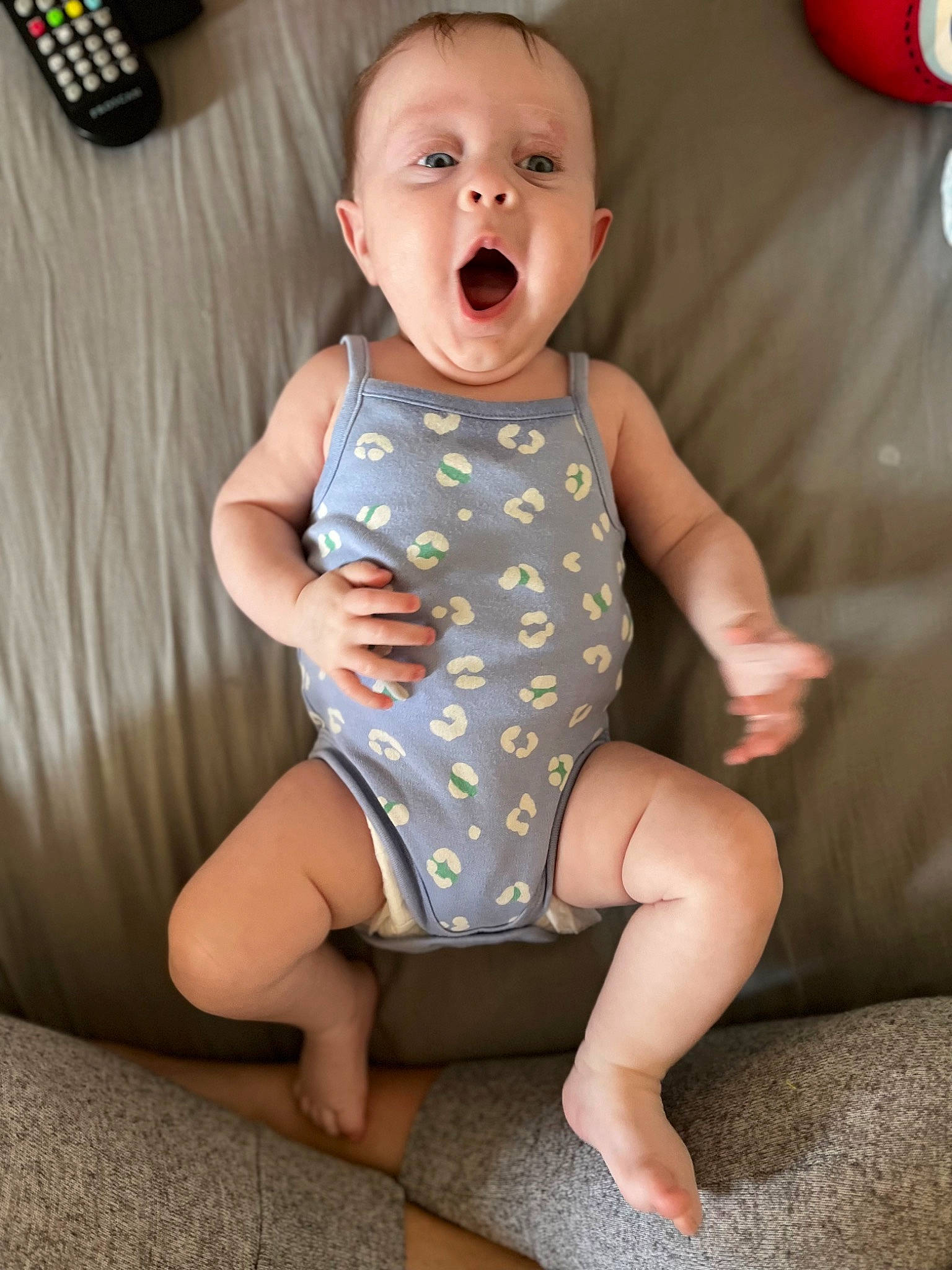 Lilley-grace is registered to the contest to win money with this photo: baby, baby_toddler_clothing, barefoot, cheek, child, comfort, eye, face, happy, human_leg, joint, knee, leg, mouth, neck, person, skin, sleeve, stomach, surprise