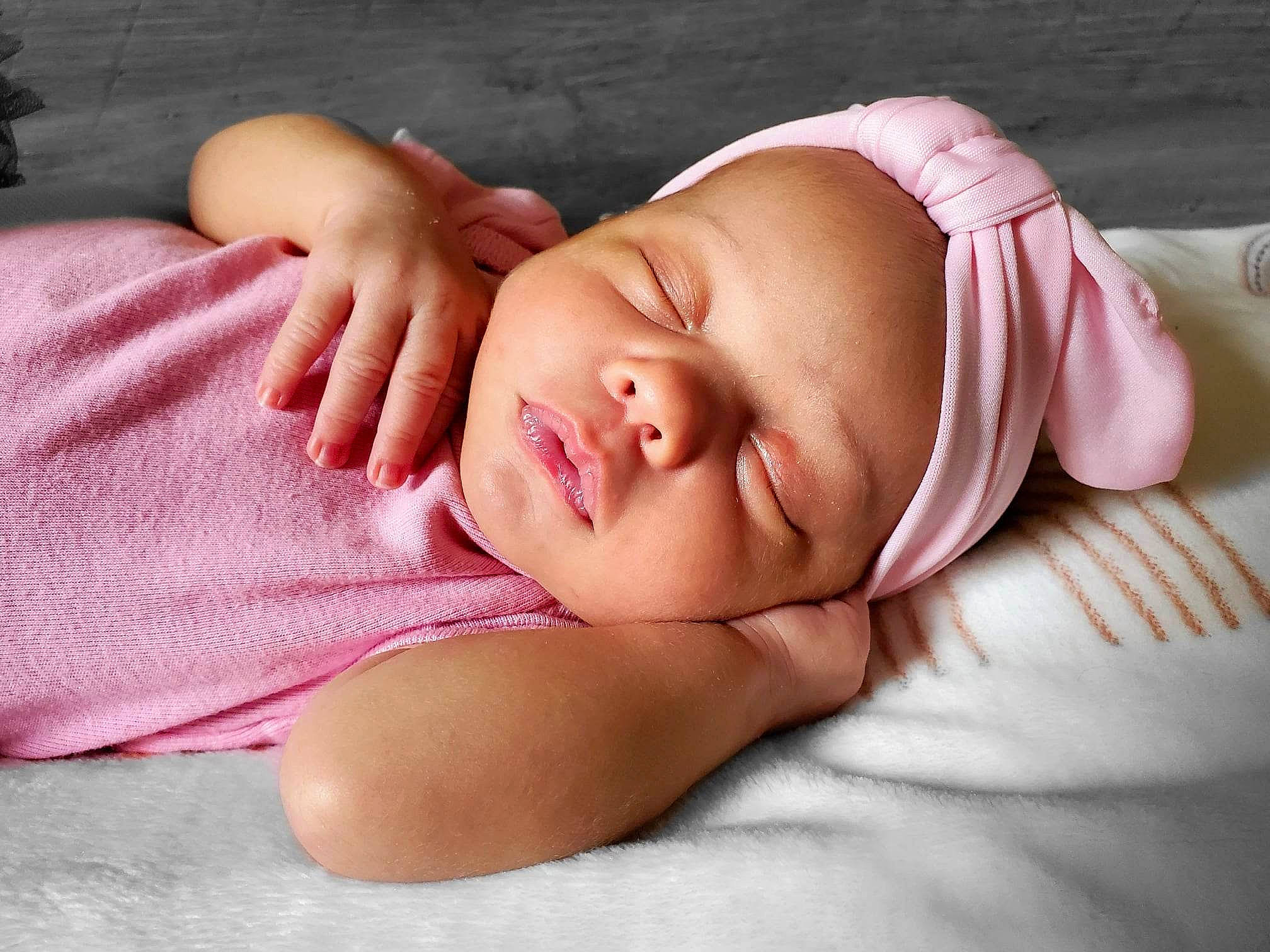 Zeniah is registered to the contest to win money with this photo: baby, baby_sleeping, baby_toddler_clothing, bedtime, cheek, child, comfort, eye, flesh, grass, head, linens, lip, nap, neck, pattern, person, pink, skin, sleeve