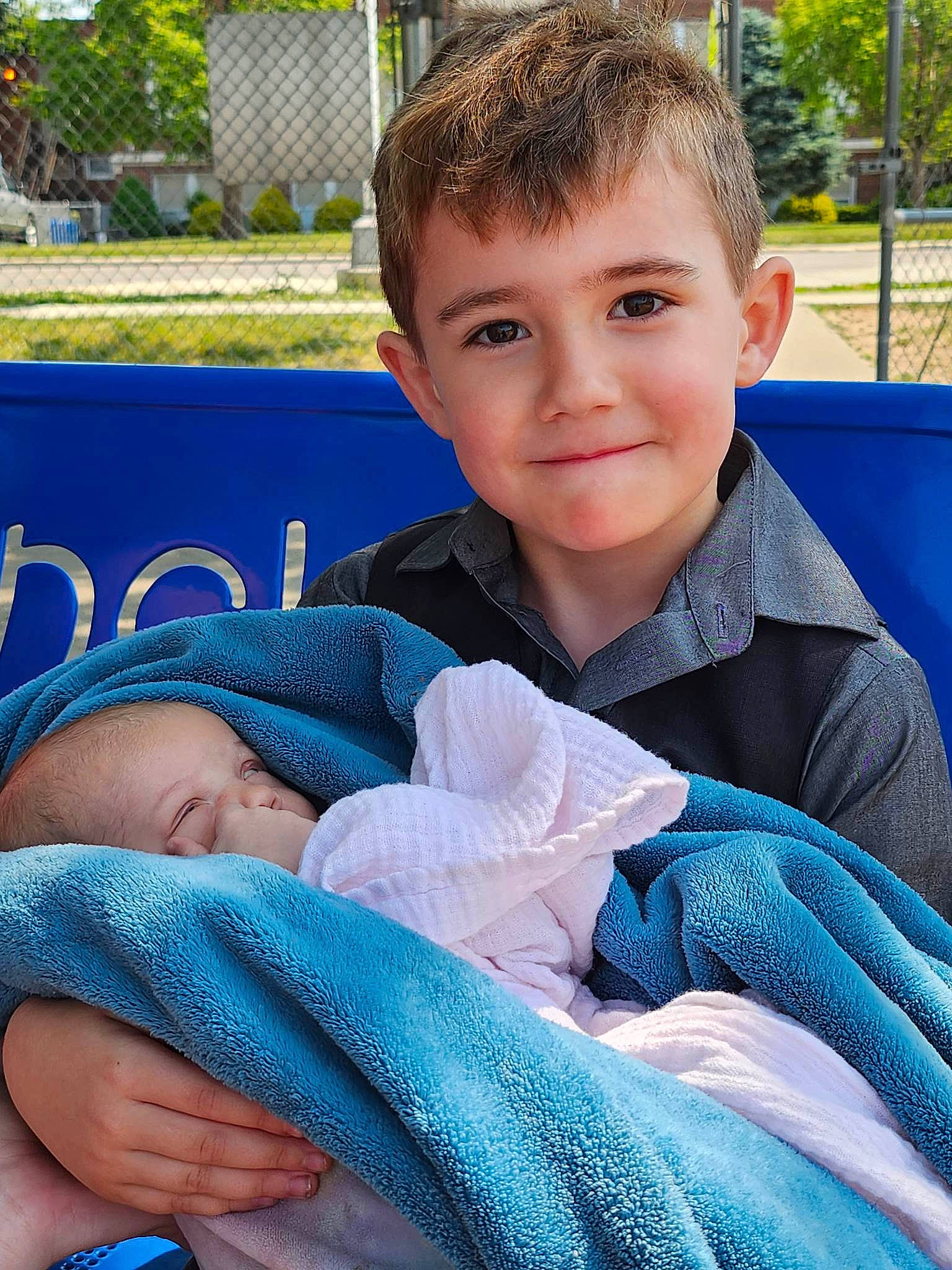 Vladimir is registered to the contest to win money with this photo: baby, baby_toddler_clothing, blue, cheek, child, chin, comfort, electric_blue, facial_expression, finger, grass, hand, happy, joy, leisure, person, plant, product, skin, sleeve