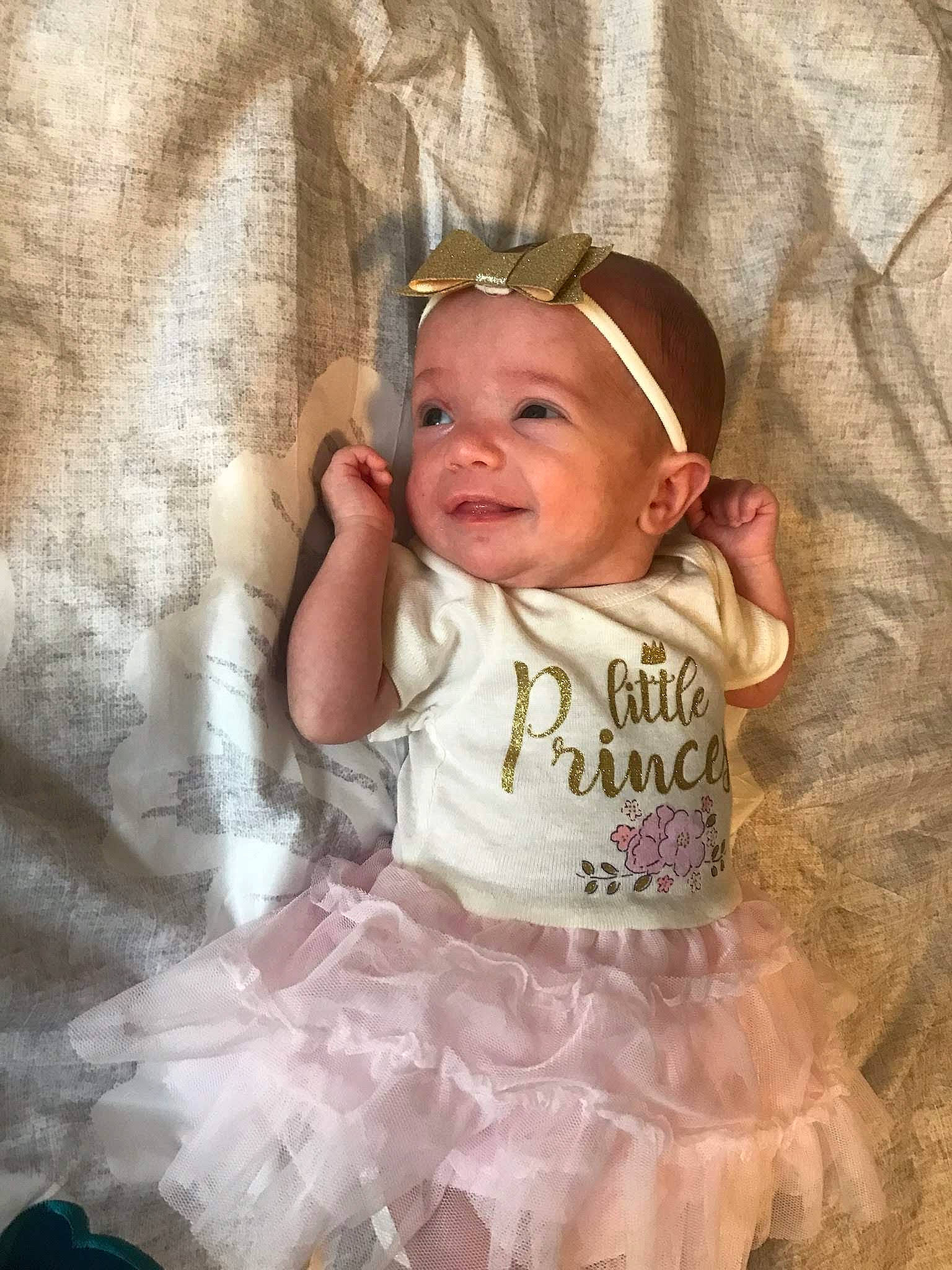 Adalena is registered to the contest to win money with this photo: baby, baby_products, baby_toddler_clothing, ballet_tutu, cheek, child, eyewear, fashion_accessory, fun, happy, iris, pattern, person, pink, ruffle, sitting, skin, sleeve, smile, textile