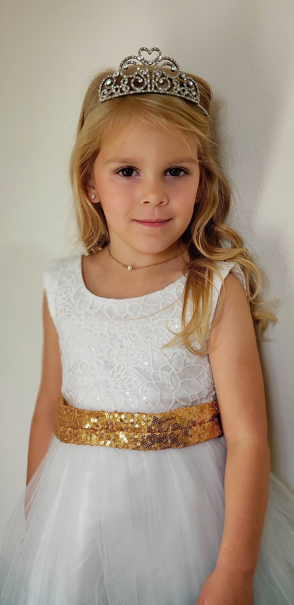 Bayleigh is registered to the contest to win money with this photo: a_line, blond, bridal_accessory, child, child_model, clothing, cocktail_dress, crown, dress, fashion_accessory, flower_girl, hair, hair_accessory, hairstyle, headband, headgear, headpiece, long_hair, person, sash