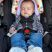 Gracie joined the competition — help win amazing prizes! baby, sleeping, car_seat, safety_harness, checkered_shirt, jeans, socks, headrest, floral_pattern, infant, child, seatbelt, resting, indoor, cute, comfort, peaceful, portrait, young_child, clothing
