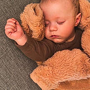 Braxton is registered to the contest to win money with this photo: baby, sleeping, blanket, couch, cozy, child, face, fur, hand, infant, peaceful, portrait, rest, soft, toddler, warm, wrapped, young, indoors, comfort