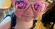 Cassidy joined the competition — help win amazing prizes! child, toddler, portrait, sunglasses, pink_glasses, striped_clothing, fashion, selfie, close_up, face, blond_hair, indoors, dog, pet, wooden_furniture, chair, table, carpet, reflection, smiling