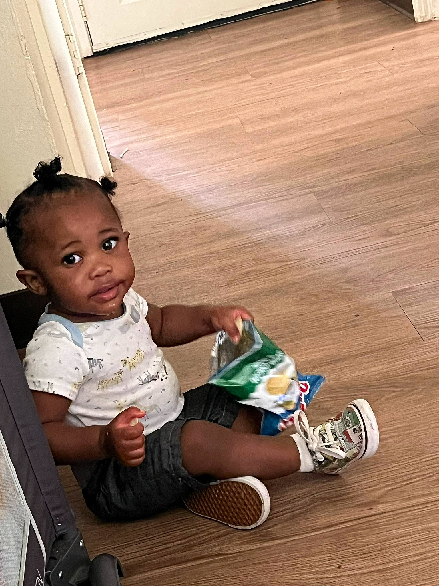 Jeremiah joined the competition — help win amazing prizes! baby, baby_toddler_clothing, child, elbow, floor, flooring, foot, happy, hardwood, human_leg, knee, leg, person, sitting, sneakers, sock, thigh, toddler, varnish, wood