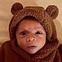 baby, infant, face, eyes, hood, brown, clothing, teddy_bear, costume, cute, warm, soft, texture, portrait, expression, child, newborn, fur, cute_outfit, indoor