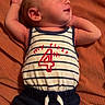 Bailey joined the competition — help win amazing prizes! baby, newborn, sleeping, infant, striped_clothing, blue_shorts, orange_blanket, cute, peaceful, portrait, child, young, resting, soft_lighting, casual_clothing, relaxed, indoors, human, one_person, lying_down