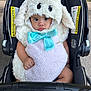 baby, black, blue_bow, child, costume, cute, expression, eyes, face, fur, grass, hands, infant, outdoor, plush, sheep, sidewalk, sitting, stroller, warning_labels
