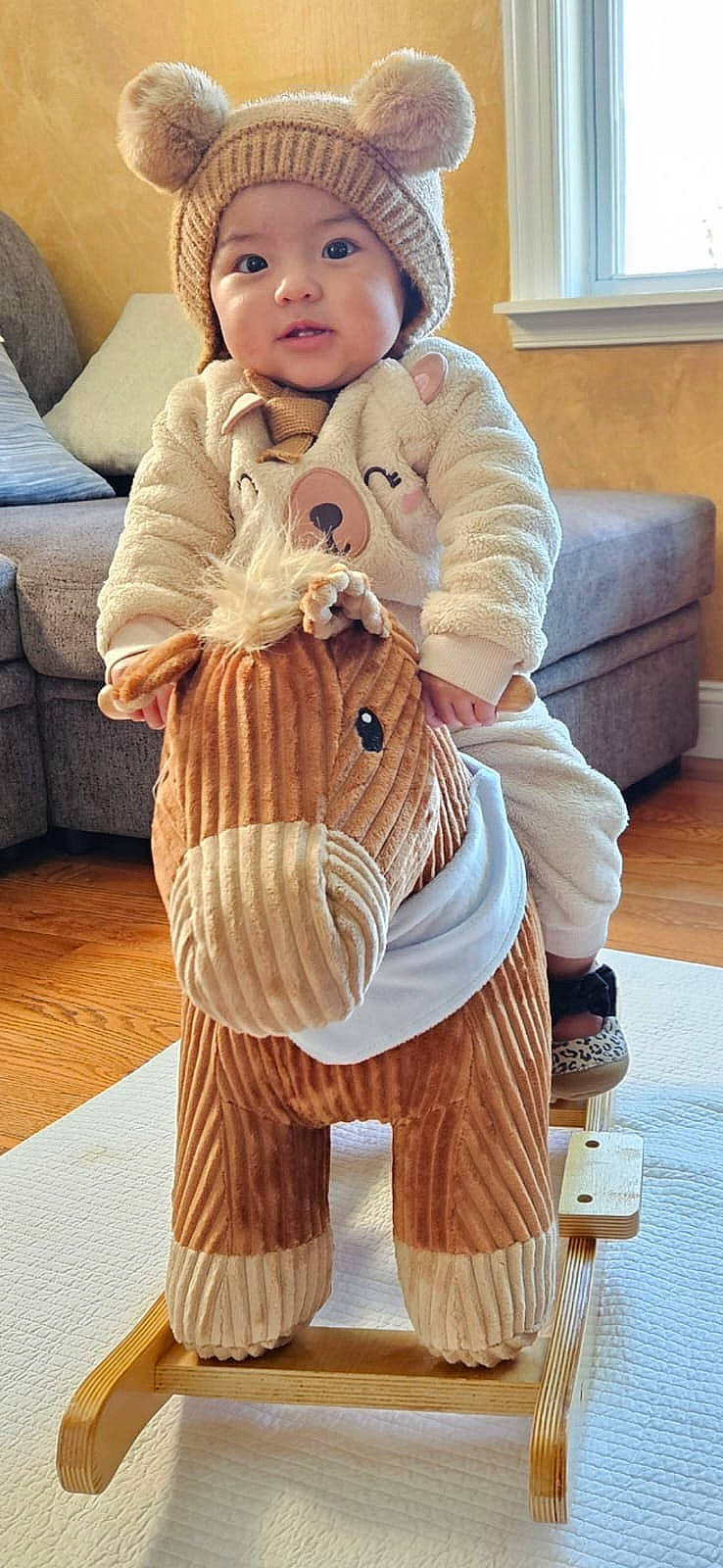 Zury joined the competition — help win amazing prizes! brown_hair, comfort, costume, couch, fawn, flooring, fur, fur_clothing, headgear, headwear, human_leg, knee, neck, peach, person, sitting, sleeve, thigh, toddler, white