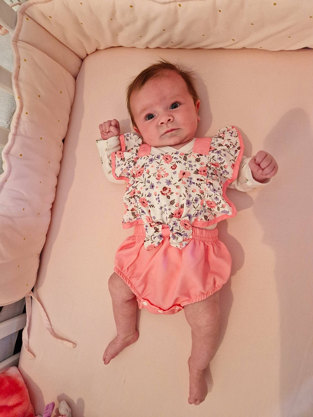 Kimly participe au concours pour gagner de l'argent avec cette photo : baby, baby_toddler_clothing, cheek, child, comfort, day_dress, embellishment, eye, face, head, human_body, human_leg, iris, pattern, person, pink, skin, sleeve, textile, thigh