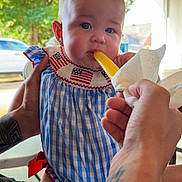 Wrenley is registered to the contest to win money with this photo: baby, child, person, blue_dress, checkered_pattern, popsicle, hand, tattoo, outdoor, greenery, car, portrait, cute, summer, food, snack, skin, expression, holding, cute_outfit