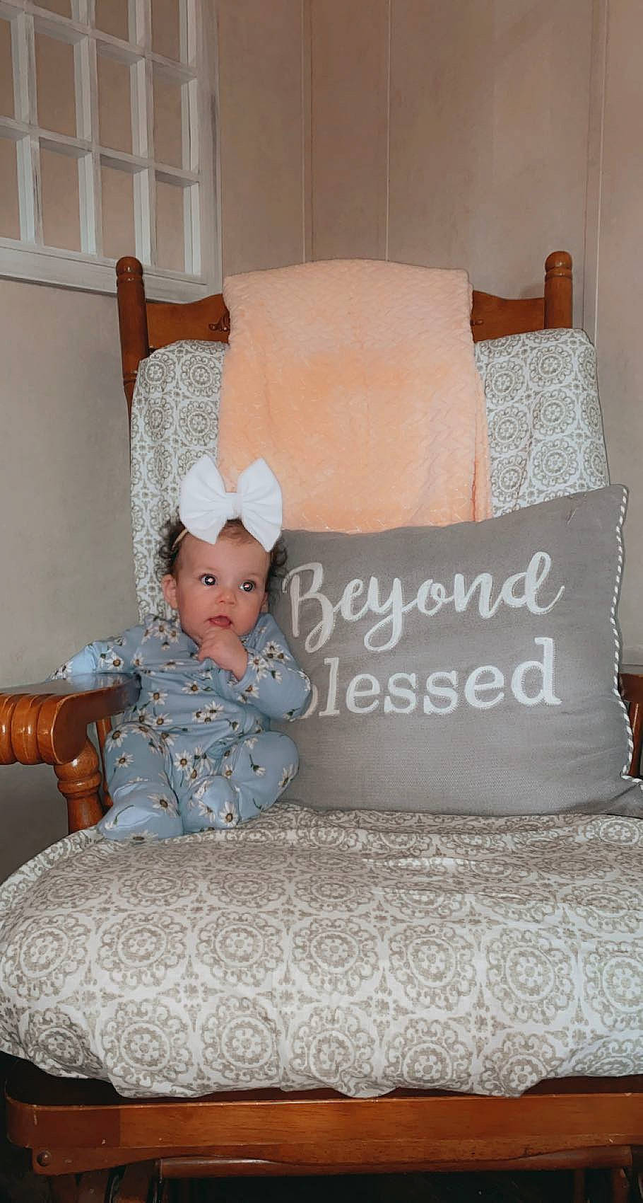 Oaklee joined the competition — help win amazing prizes! baby_toddler_clothing, bed_frame, bedding, bedroom, chair, comfort, couch, floor, flooring, font, furniture, hardwood, interior_design, linens, living_room, person, pillow, textile, throw_pillow, toddler