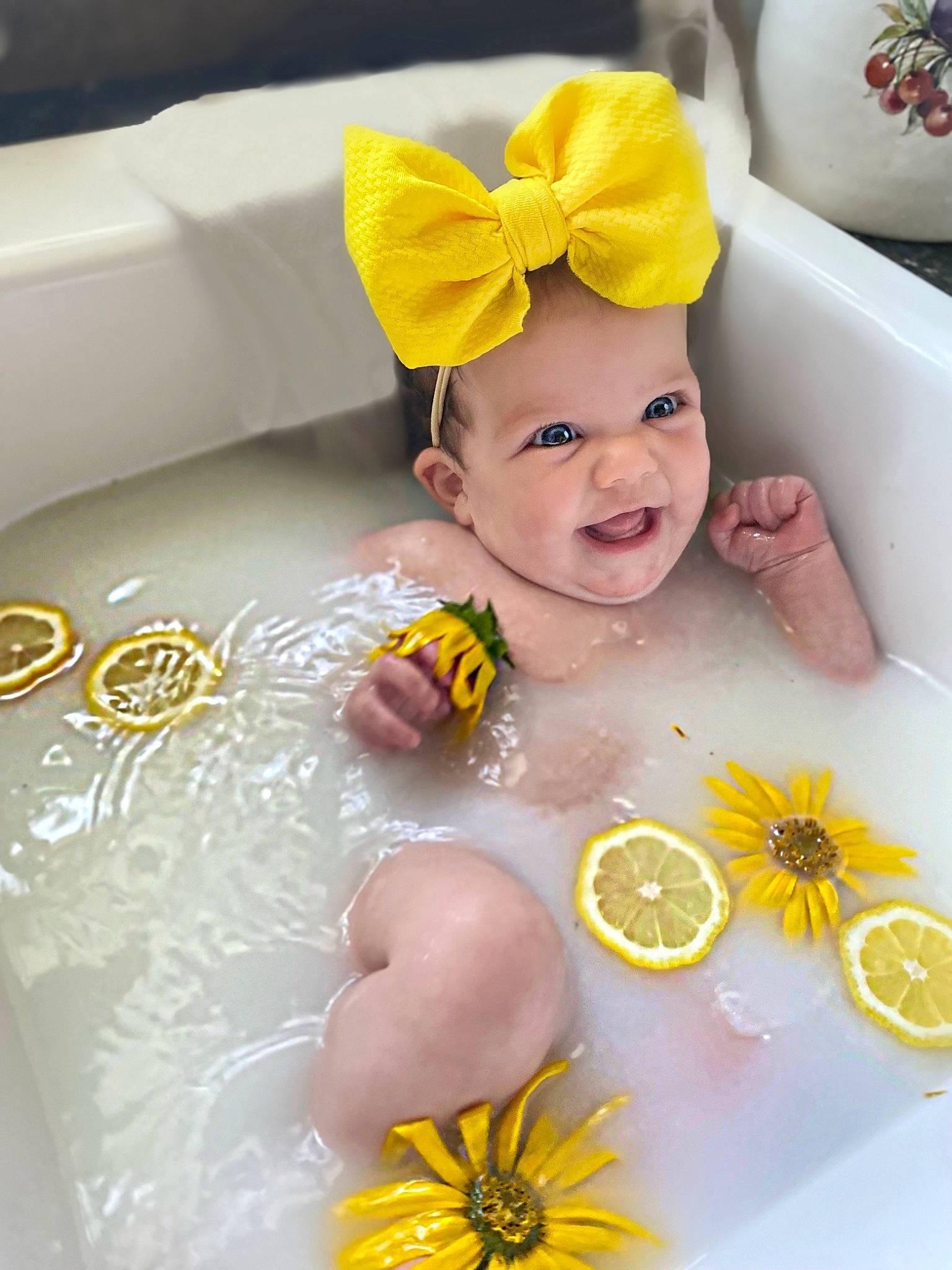 Oaklee joined the competition — help win amazing prizes! baby, baby_toddler_clothing, cap, child, citrus, costume_hat, fruit, happy, headpiece, headwear, orange, person, petal, serveware, skin, smile, sunglasses, tableware, toddler, valencia_orange