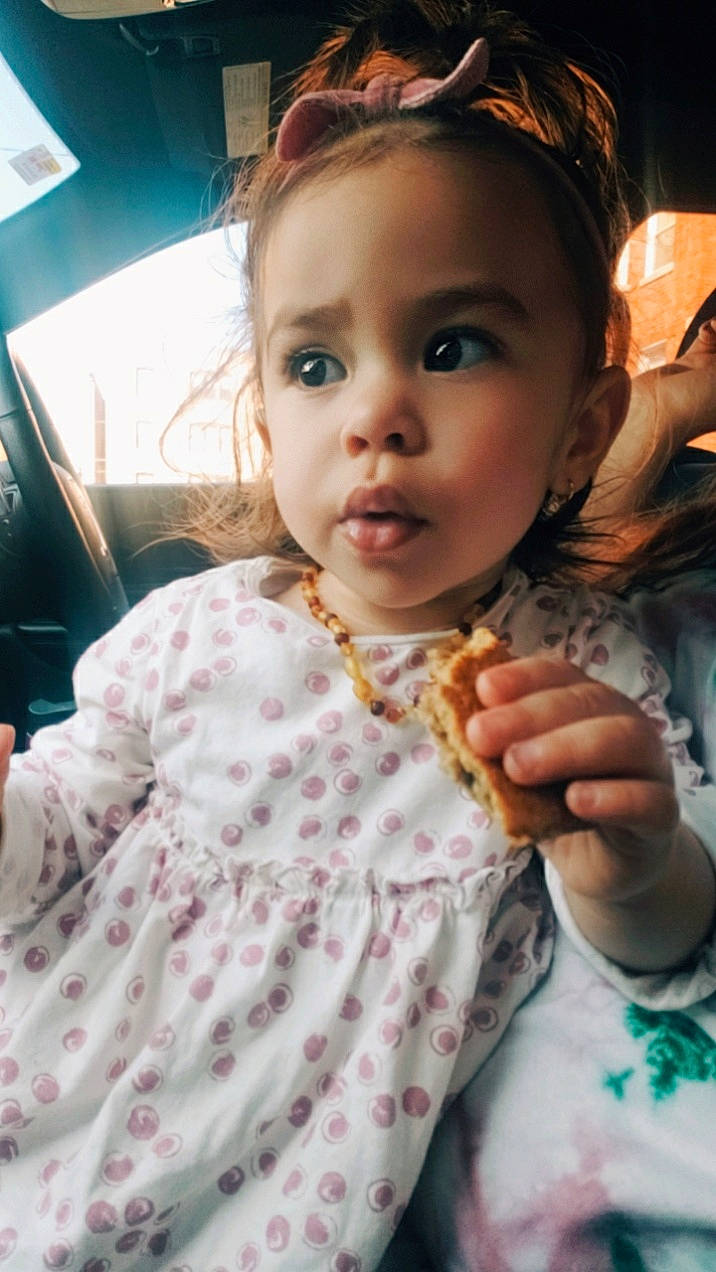 Gianna is registered to the contest to win money with this photo: baby_toddler_clothing, blond, brown_hair, child, ear, eye, eyelash, fashion_accessory, fun, gesture, hairstyle, happy, headpiece, iris, lip, mouth, neck, nose, person, skin